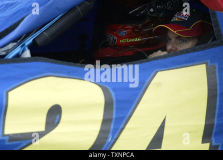 Nascar driver Jeff Gordon sits in his car during a rain delay prior to the start of the 3M Performance 400 at The Michigan International Speedway in Brooklyn, Mi on June 18, 2006. (UPI Photo/Scott R. Galvin) Stock Photo