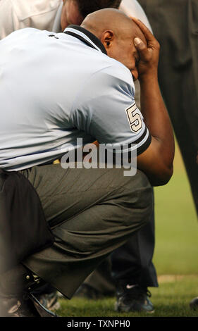 Home Plate Umpire CB Bucknor Reacts After Being Hit By A Pitch Before ...