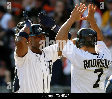 Detroit Tigers Craig Monroe is congratulated by teammate Curtis