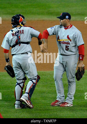 https://l450v.alamy.com/450v/txnr7p/st-louis-cardinals-infielder-albert-pujols-5-and-catcher-yadier-molina-4-celebrate-their-teams-7-2-victory-over-the-detroit-tigers-in-game-1-of-the-world-series-at-comerica-park-in-detroit-on-october-21-2006-upi-photokevin-dietsch-txnr7p.jpg