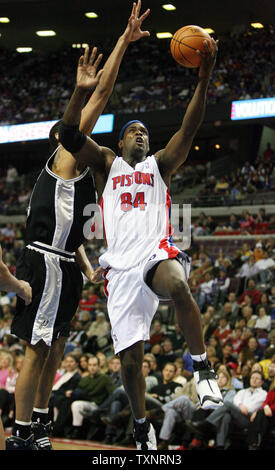 Detroit Pistons center Chris Webber (84) takes the ball past San Antonio Spurs forward Tim Duncan for a shot in the fourth quarter at The Palace of Auburn Hills in Auburn Hills, Michigan on February 14, 2007.  The Spurs defeated the Pistons 90-81.  (UPI Photo/Scott R. Galvin) Stock Photo