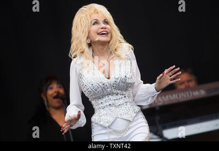 American country star Dolly Parton performing on the main Pyramid Stage of Glastonbury Festival in 2014. Glastonbury Festival of Contemporary Performing Arts is the largest music festival in UK, attracting over 135,000 people each to Pilton, Somerset. Stock Photo