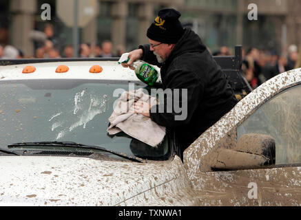 A worker cleans a windshield before Chrysler debuts their updated Ram 1500 at the 2008 North American International Auto Show in Detroit January 13, 2008.  (UPI Photo/Mark Cowan) Stock Photo