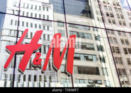 NEW YORK - CIRCA MARCH 2016: close up shot of H and M logo. H and M Hennes and Mauritz AB is a Swedish multinational retail-clothing company, known Stock Photo