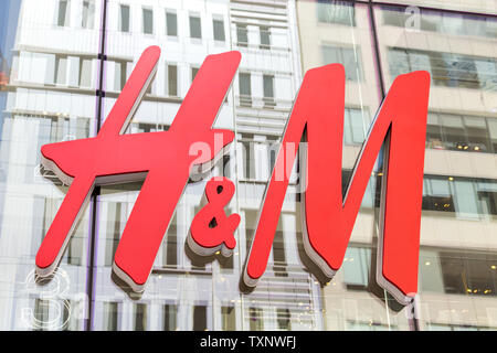 NEW YORK - CIRCA MARCH 2016: close up shot of H and M logo. H and M Hennes and Mauritz AB is a Swedish multinational retail-clothing company, known Stock Photo