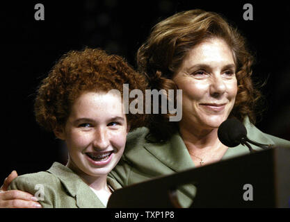 Teresa Heinz Kerry gives 12-year-old Allison Dobson of Oakland a hug while the two speak at the Kids For Kerry Youth Caucus, at the John B. Hynes Veterans Memorial Convention Center in Boston on July 29, 2004.  (UPI Photo/Bill Greenblatt) Stock Photo