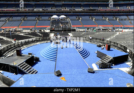 Workers put the finishing touches on the stage in preparation for the final day of the Democratic National Convention in Invesco Field at Mile High in Denver on August 27, 2008. Sen. Barack Obama (D-IL) will deliver his acceptance speech in front of thousands of spectators in the stadium. (UPI Photo/Kevin Dietsch) Stock Photo