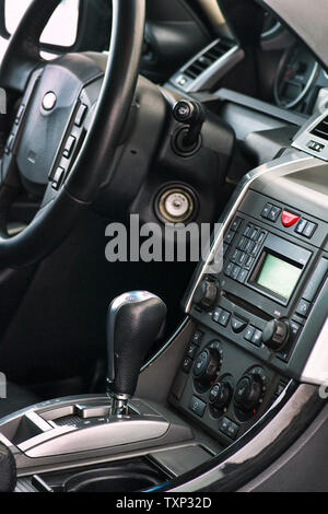 Grodno, Belarus, December 2012: Land Rover Range Rover Sport 5.0L V8 Supercharged. Luxury prestige car interior details. Middle console with gearbox a Stock Photo