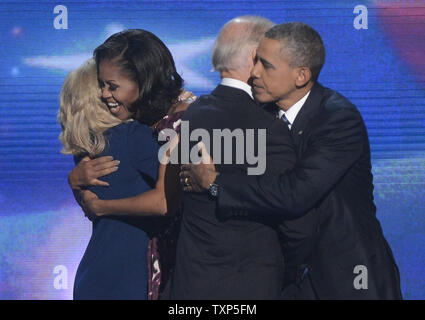 (L-R) Dr. Jill Biden, First Lady Michelle, Vice President Joe Biden and President Barack Obama embrace at the 2012 Democratic National Convention at the Time Warner Cable Arena in Charlotte, North Carolina on September 6, 2012.     UPI/Kevin Dietsch Stock Photo