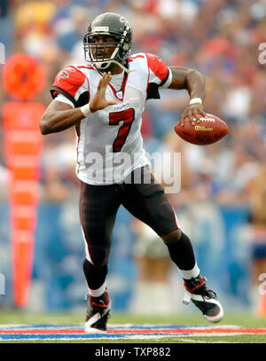 Atlanta Falcons QB Michael Vick scrambles with the football against the Buffalo  Bills on September 25, 2005. The Falcons, defeated the Bills 24-16, in the  matchup at Ralph Wilson Stadium in Orchard