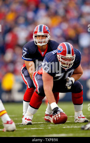 Buffalo Bills quarterback JP Losman (7) is helped up by Marshawn