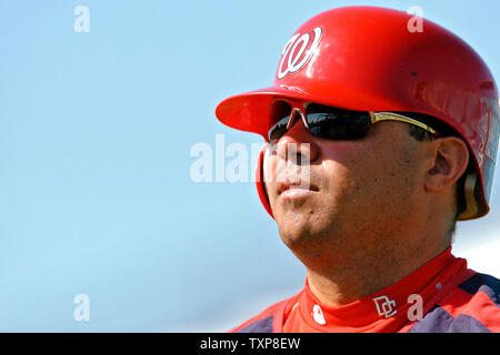 Washington Nationals second baseman Jose Vidro looks towards the dugout during batting practice prior to a Spring Training game against the Baltimore Orioles at Space Coast Stadium, in Viera Florida. The Nationals defeated the Orioles 10-6 in their first Grapefruit League matchup of the season.  (UPI Photo/Ed Wolfstein) Stock Photo