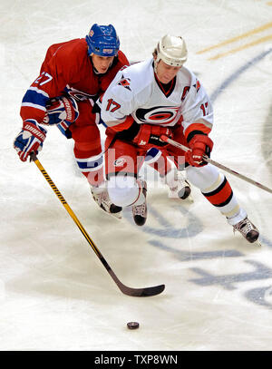 Carolina Hurricanes center and team captain Rod Brind'Amour (17) is chased by Montreal Canadiens right wing forward Alexei Kovalev (27) of Russia in the first period at the Bell Centre in Montreal, Canada on February 6, 2007. (UPI Photo/Ed Wolfstein) Stock Photo
