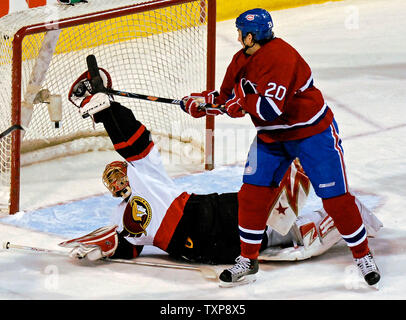 Ottawa Senators goaltender Ray Emery (1) makes a glove save against Montreal Canadiens right wing forward Mike Johnson (20) in the first period against the Montreal Canadiens at the Bell Centre in Montreal, Canada on February 10, 2007. (UPI Photo/Ed Wolfstein) Stock Photo