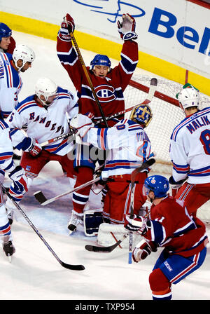 Montreal Canadiens right wing forward Alexei Kovalev of Russia (27, center) celebrates scoring the Canadiens' fifth goal against the New York Rangers in the second period at the Bell Centre in Montreal, Canada on March 27, 2007. The Canadiens defeated the Rangers 6-4. (UPI Photo/Ed Wolfstein) Stock Photo