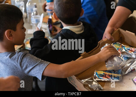 Migrants released from ICE custody eat lunch at Camino de Vida in El Paso, Texas on March 22, 2019. Border Patrol detention centers have soared past capacity, prompting the mass release of migrants. ICE is set to release upwards of 600 migrants per day from March 22 through March 24.      Photo by Justin Hamel/UPI Stock Photo