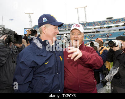 West Virginia head coach Bill Stewart (L) and Florida State head coach Bobby Bowden greet at mid-field prior to the start of the Konica Minolta Gator Bowl January 1, 2010 in Jacksonville, Florida.  The Gator Bowl will be Bobby Bowden's final game.  UPI/Mark Wallheiser Stock Photo