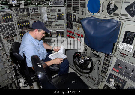 STS 1 Timothy Erickson of the fast attack submarine, USS Hampton which was commissioned in 1993, monitors navigation equipment on May 2, 2006 in Ft. Lauderdale, Fl. The Hampton is berthed at Port Everglades during Fleet Week USA. (UPI Photo / Joe Marino - Bill Cantrell) Stock Photo