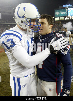 Kicker Mike Vanderjagt, of the Indianapolis Colts, embraces kicker Adam  Vinatieri, of the New England Patriots, following the Patriots victory over  the Colts, in the AFC Championship Game, Sunday, January 18, 2004,