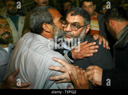 Hamas new leader Abdel Aziz Rantisi is greeted by his supporters in ...