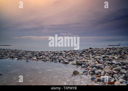 A beautiful summer sunset was photographed from Spiral Beach in Victoria,  Canada. The view is of the Olympic Mountains range across the Salish Sea  Stock Photo - Alamy