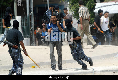 Palestinian Security forces from Hamas arrest members of the Fatah movement during clashes in Rafah in southern Gaza  on September 7, 2007. Security forces from the Hamas Islamist movement clashed with protesters in the Gaza Strip on Friday, as members of the rival Fatah faction gathered to pray in defiance of a ban imposed on open-air gatherings.   (UPI Photo/Ismael Mohamad) Stock Photo