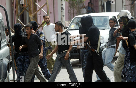 Palestinian Security forces from Hamas arrest members of the Fatah movement during clashes in Rafah in southern Gaza  on September 7, 2007. Security forces from the Hamas Islamist movement clashed with protesters in the Gaza Strip on Friday, as members of the rival Fatah faction gathered to pray in defiance of a ban imposed on open-air gatherings.   (UPI Photo/Ismael Mohamad) Stock Photo