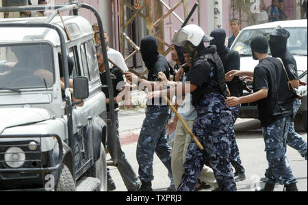 Palestinian Security forces from Hamas arrest members of the Fatah movement during clashes in Rafah in southern Gaza  on September 7, 2007. Security forces from the Hamas Islamist movement clashed with protesters in the Gaza Strip on Friday, as members of the rival Fatah faction gathered to pray in defiance of a ban imposed on open-air gatherings.   (UPI Photo/Ismael Mohamad) Stock Photo