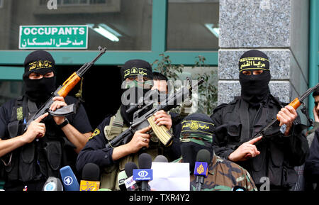 Members of the Islamic Jihad's military wing, the al-Quds Brigades, hold a news conference, in Gaza,  March 12, 2012. Three Palestinians were killed 12 March, including a teenager on his way to school, in the worst round of Gaza-Israel violence in at least seven months. UPI/Ashraf Amra Stock Photo