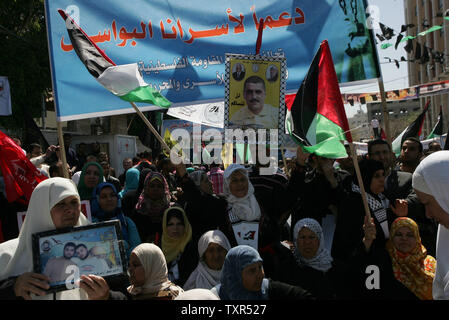 Palestinians demonstrate in Gaza City on April 17, 2012 in solidarity with prisoners held in Israel. Some 1,200 Palestinian prisoners held in Israeli jails have begun a hunger strike and another 2,300 are refusing food for one day, Palestinians across the West Bank and Gaza Strip were marking Prisoners' Day in solidarity with the 4,700 Palestinian inmates of Israeli jails. UPI/Ismael Mohamad Stock Photo