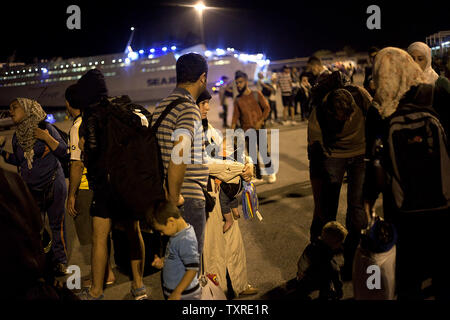 Migrants disembark from the passenger ship 'Tera Jet', following their trip from the island of Lesbos to the port of Piraeus, near Athens, Greece on September 1, 2015. Another 1,700 migrants arrived aboard the ferry to Piraeus from the island of Mytilene, migrants arriving on its eastern Aegean islands, with more than 160,000 landing so far this year. Europe is struggling to respond to its biggest migration crisis since World War II, with more than 300,000 people arriving this year. photo by Yuksel Pecenek/ UPI Stock Photo