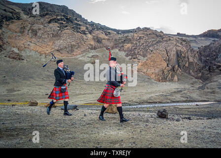 Scottish pipers in Icelandic Desert. Stock Photo