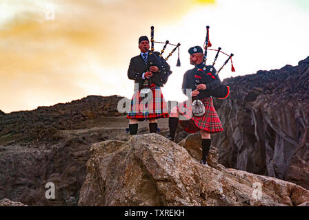 Scottish pipers in Icelandic Desert. Stock Photo