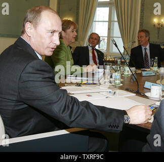 (L-R) Russian President Vladimir Putin, German Chancellor Merkel, U.S. President George W. Bush and British Premier Tony Blair  begin the G8 working session in Heiligendamm, Germany on June 7, 2007. The leaders of the G8 nations are holding their annual summit in the historic Heiligendamm sea resort on June 6-8, 2007. (UPI Photo/Anatoli Zhdanov) Stock Photo