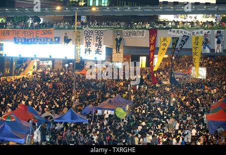 Pro-democracy activists hold a massive protest on a closed thoroughfare next to the government's headquarters in downtown Hong Kong on October 10, 2014.  Thousands of pro-democracy supporters returned to the streets Friday night after protest leaders implored them to dig in for the long haul following the collapse of talks with the government.     UPI/Stephen Shaver Stock Photo