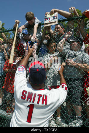 Former St. Louis Cardinals shortstop and Baseball Hall of Famer Ozzie Smith reaches for a baseball to autograph following his 'Turn Two with Ozzie,' fundraiser at Doubleday Field in Cooperstown, NY on July 29, 2005. Smith, along with former Kansas City Royals George Brett and former New York Mets Gary Carter teamed up with regular baseball fans to raise money for the National Baseball Hall of Fame Educational Department. This year former Chicago Cubs Ryne Sandberg and former Boston Red Sox Wade Boggs will be inducted in the baseball shrine as the class of 2005 on July 31, 2005. (UPI Photo/Bill Stock Photo