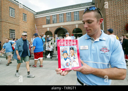 Baseball Hall of Fame worker Scott Yaple displays the new official Ryne Sandberg-Wade Boggs yearbook, outside the National Baseball Hall of Fame and Museum  in Cooperstown, NY on July 30, 2005. Sandberg and Boggs will be inducted on July 31. (UPI Photo/Bill Greenblatt) Stock Photo