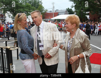 Former St. Louis Cardinals manager Whitey Herzog and wife Mary Lou wave to  friends during a parade up Main Street in Cooperstown, New York on July 24,  2010. Herzog will be enshrined