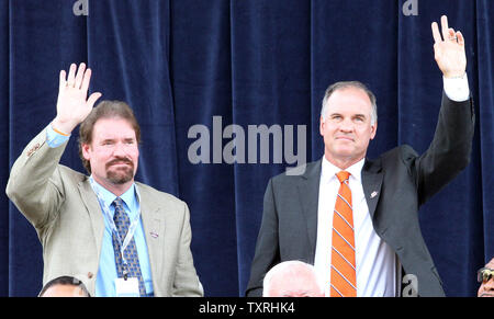 National Baseball Hall of Fame members Wade Boggs (L) and Ryne Sandberg wave to the crowd as they are introduced before an awards ceremony at Doubleday Field in Cooperstown, New York on July 23, 2011. Both men were inducted into the Hall of Fame in 2005. UPI/Bill Greenblatt Stock Photo