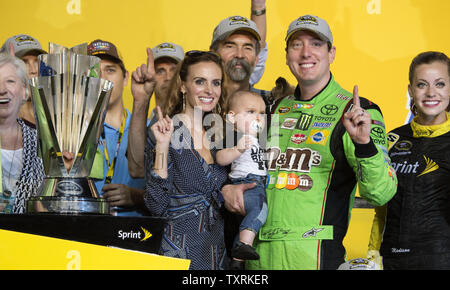 Racer Kyle Busch, driver for M&M's Crispy Toyota and his family celebrate winning the 2015 NASCAR SPRINT CUP Series Championship at the Homestead-Miami Speedway on November 22, 2015. .Photo by Joe Marino-Bill Cantrell/UPI Stock Photo