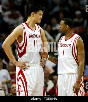 Houston Rockets Center Yao Ming (11) talks with teammate