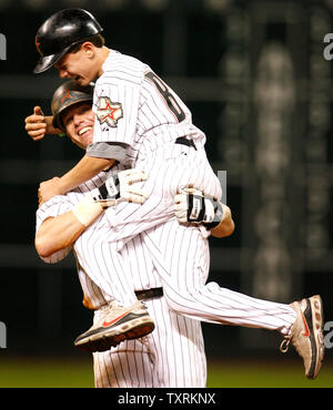 Houston Astros second baseman Craig Biggio (L) hugs his son Conor