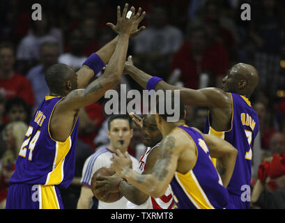 Houston Rockets forward Carl Landry (C) grabs a rebound over Los Angeles Lakers guard Kobe Bryant (L), guard Shannon Brown (2R) and forward Lamar Odom (R) in the first half of Game 6 of the Western Conference semifinals at Toyota Center in Houston, Texas on May 14, 2009. (UPI Photo/Aaron M. Sprecher) Stock Photo