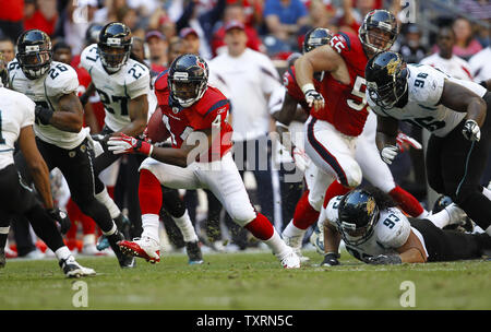 Houston Texans running back Ben Tate (C) rushes for a gain against the Jacksonville Jaguars in the second half at Reliant Stadium in Houston, Texas on October 30, 2011. The Texans defeated the Jaguars 24-14.   UPI/Aaron M. Sprecher Stock Photo