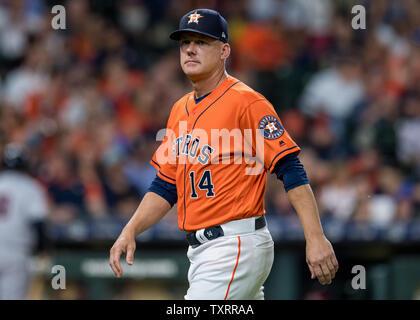 Houston Astros manager A.J. Hinch watches as players practice during a ...