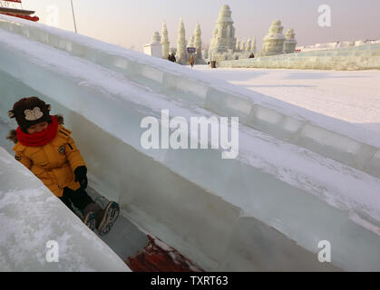 A Chinese boy slides down an ice slide at the 33rd Harbin International Ice and Snow Sculpture Festival that opened last week in Harbin, the capital of China's Northeastern Heilongjiang Province, on January 7, 2017.  The annual festival's major venue, billed as the world's biggest outdoor 'freezing' park, attracted over a million tourists last year to see the vast collection of elaborately carved ice structures and sculptures.    Photo by Stephen Shaver/UPI Stock Photo