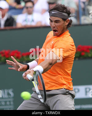 Spaniard Rafael Nadal prepares to hit a shot during his mens final match against Serbian Novak Djokovic at the BNP Paribas Open in Indian Wells, California on March 20, 2011.  Djokovic defeated Nadal 4-6, 6-3, 6-2 to win the tournament.   UPI/David Silpa Stock Photo