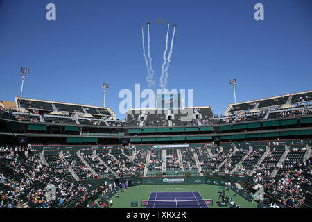 Military jets fly over the stadium before the start of the women's final match between Bianca Andreescu of Canada and Angelique Kerber of Germany at the BNP Paribas Open in Indian Wells, California on March 17, 2019.   Photo by David Silpa/UPI Stock Photo