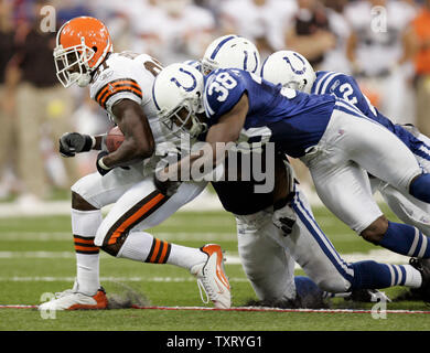 Cleveland Browns wide receiver Antonio Bryant (81) is tackled by Indianapolis Colts defenders Gerome Sapp (38), Gary Brackett (58) and Jason David (42) at the RCA Dome in Indianapolis, on September 25, 2005. The Indianapolis Colts defeated the Cleveland Browns 13-6. (UPI Photo/Mark Cowan) Stock Photo