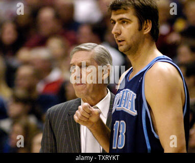 Utah Jazz head coach Jerry Sloan and forward Mehmet Okur (13) watch during the Pacers' 93-83 win over the Jazz at Conseco Fieldhouse in Indianapolis on December 16, 2005. (UPI Photo/Mark Cowan) Stock Photo